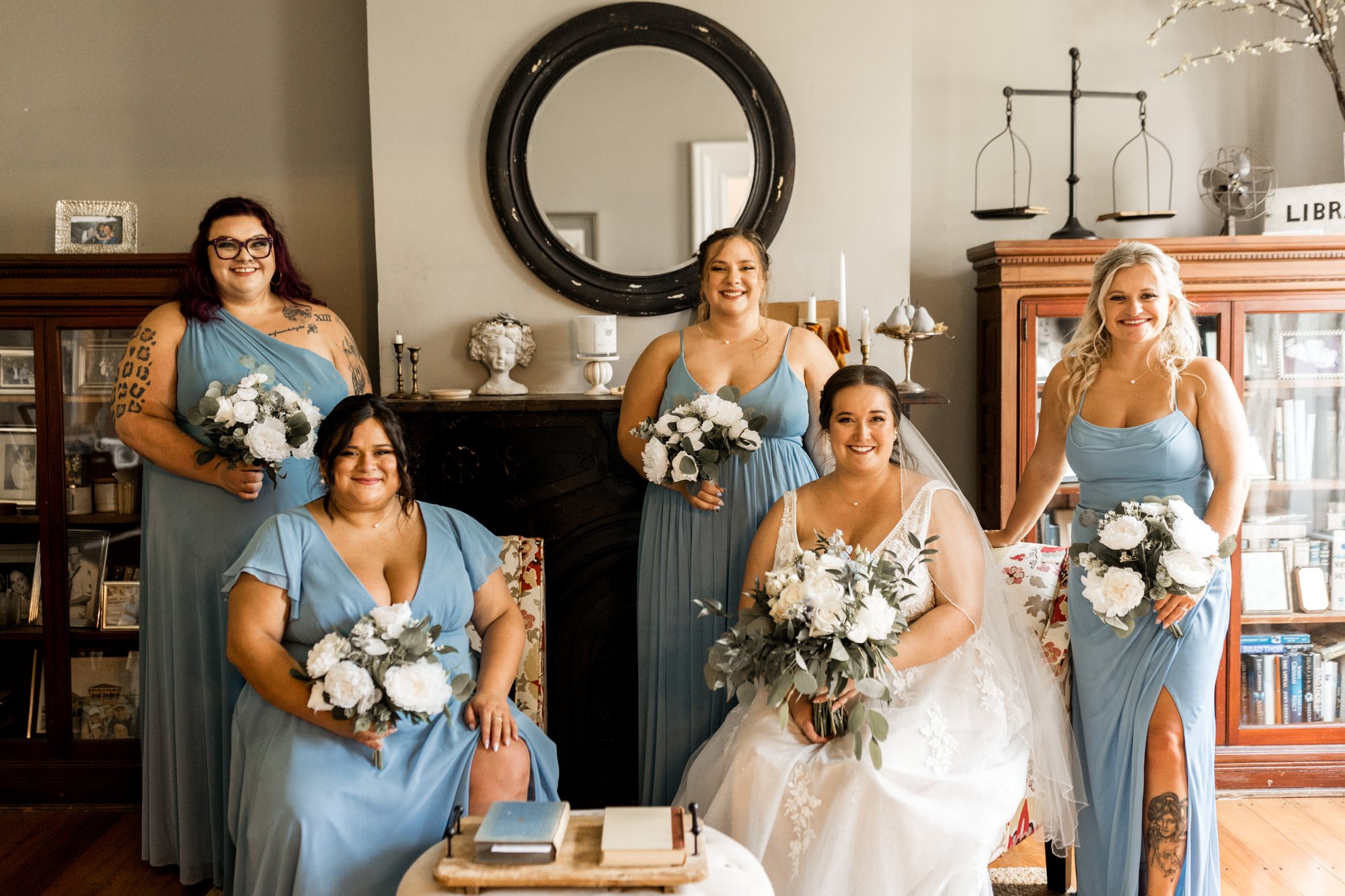 Bridesmaids getting ready inside the farmhouse.