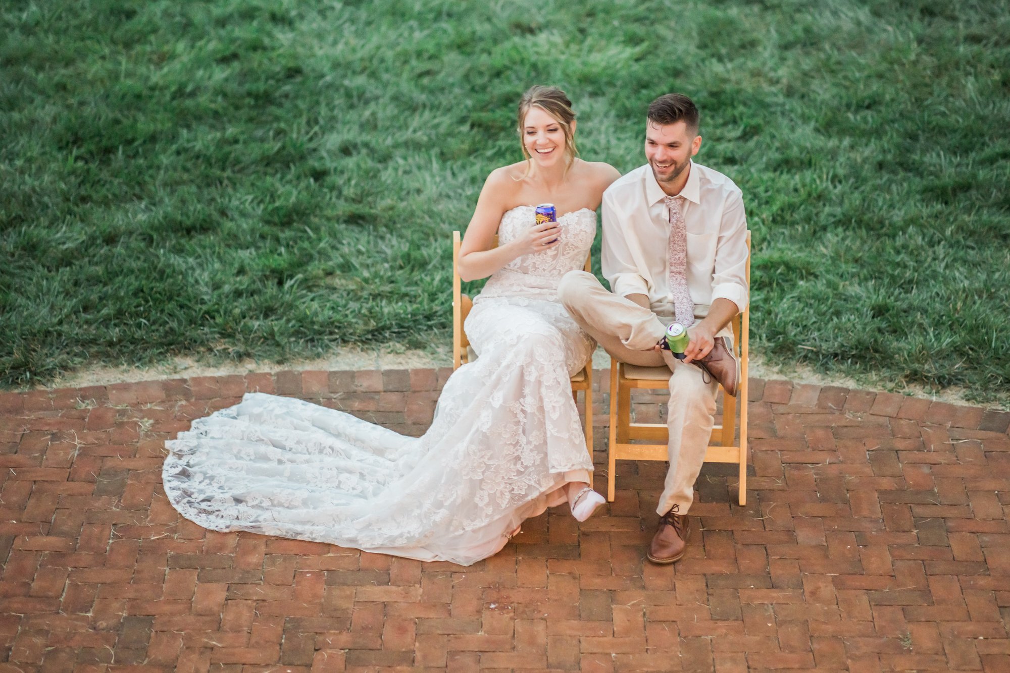 A couple sitting out on the patio in the evening.